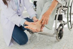 NP checks patient with chronic pain