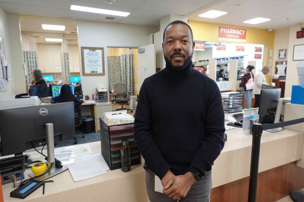 Darryn Harris is tasked with training more than 1,000 St. John’s staffers on what to do if immigration agents ent er a clinic. (Jackie Fortiér/KFF Health News)