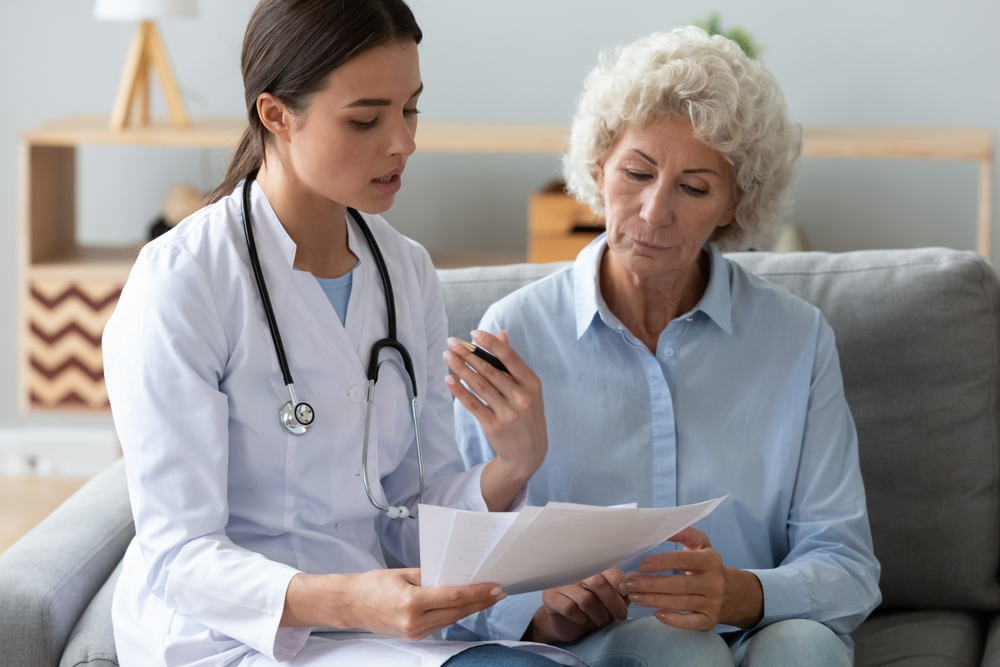 NP discussing vaccines with older patient