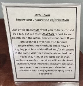 A sign labeled 'Attention: Important insurance information' reads 'Our office does NOT want you to be surprised by a bill, but we must ALWAYS report to your health plan the actual services rendered.'