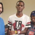 Zohny Zohny (left), a neurosurgeon, stands with his patient Larry Black Jr. and Black’s sister Molly Watts in a photograph taken at a follow-up medical appointment in 2019. Black was shot in the head in St. Louis earlier that year. (Zohny Zohny)