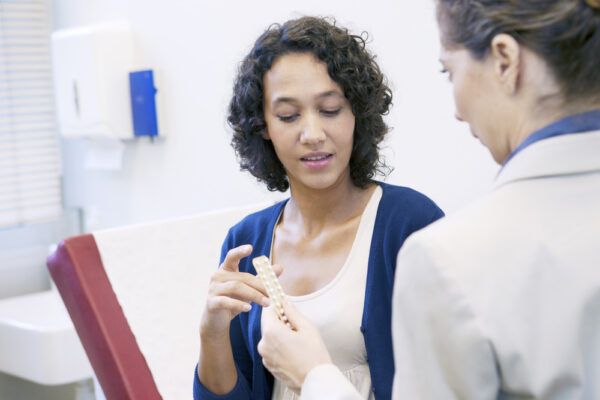 NP discussing contraception with patient